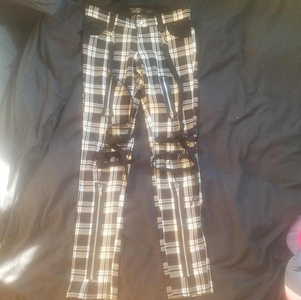 Plaid pants with zippers and straps
